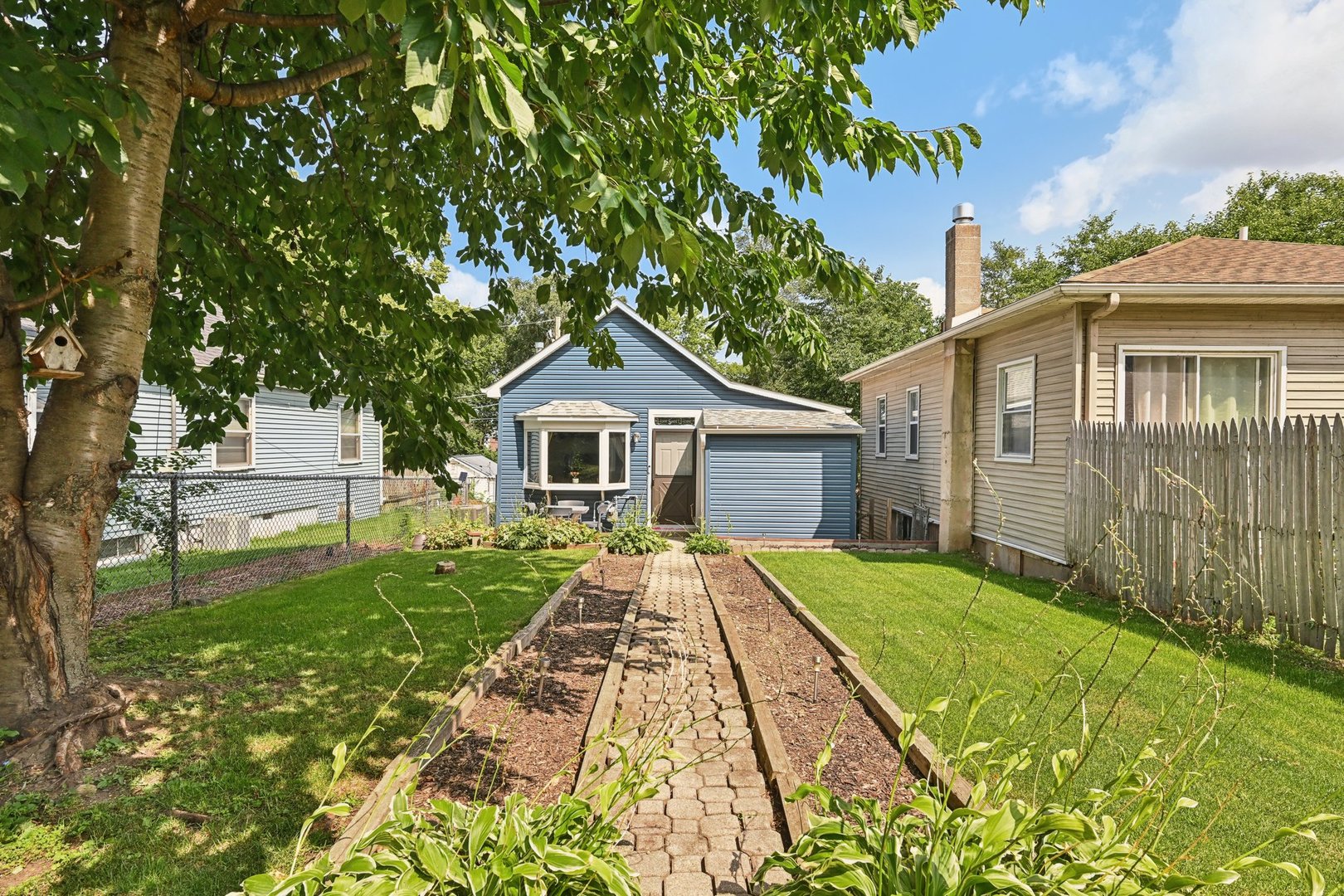 a front view of a house with yard