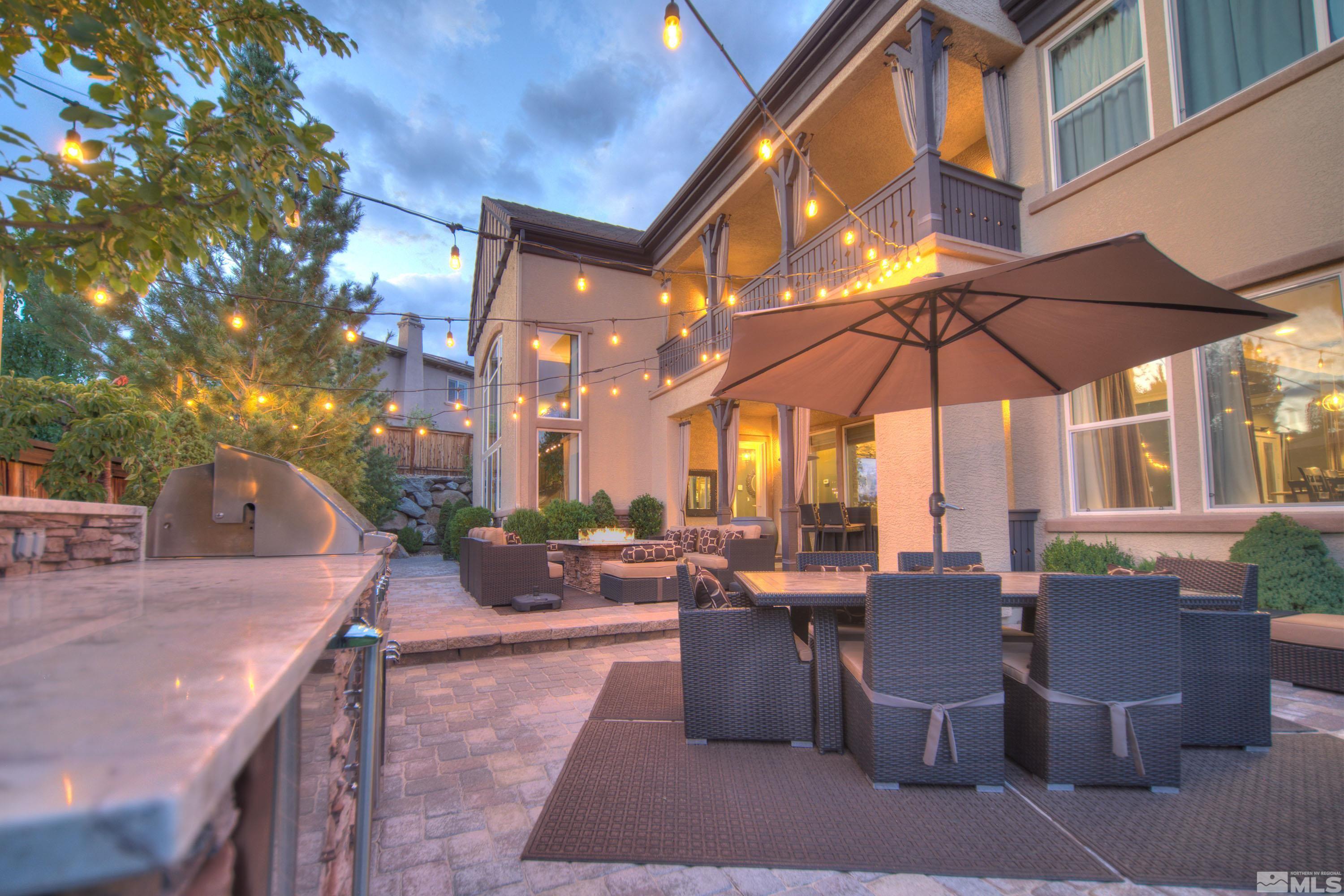 a view of a patio with chairs and tables