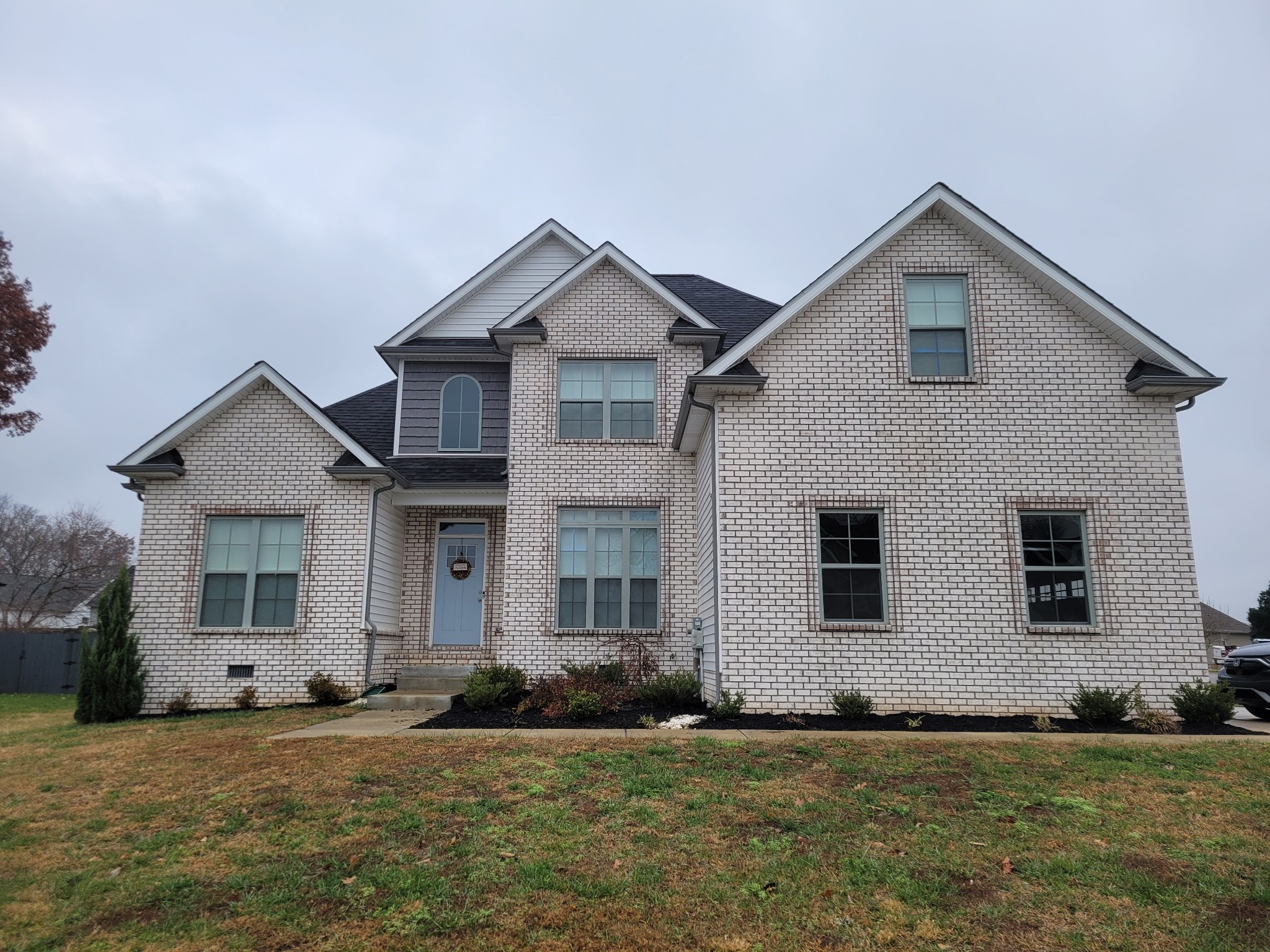 a front view of a house with a yard