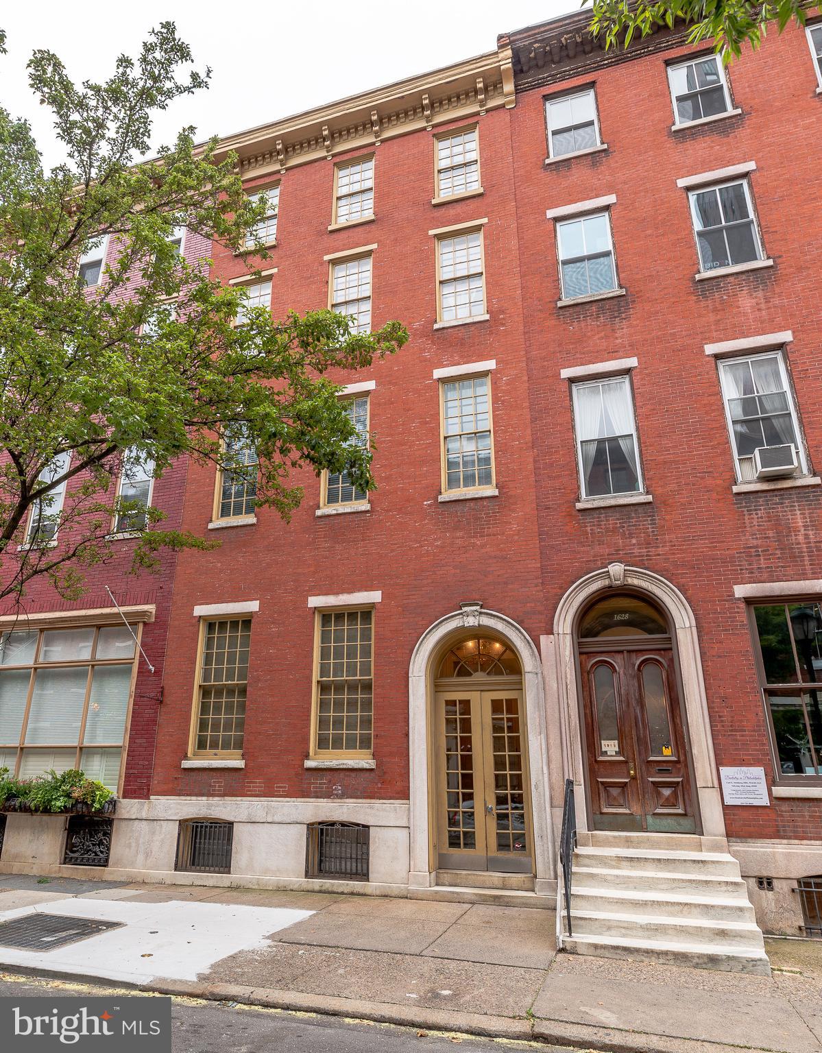 a front view of a multi story residential apartment building