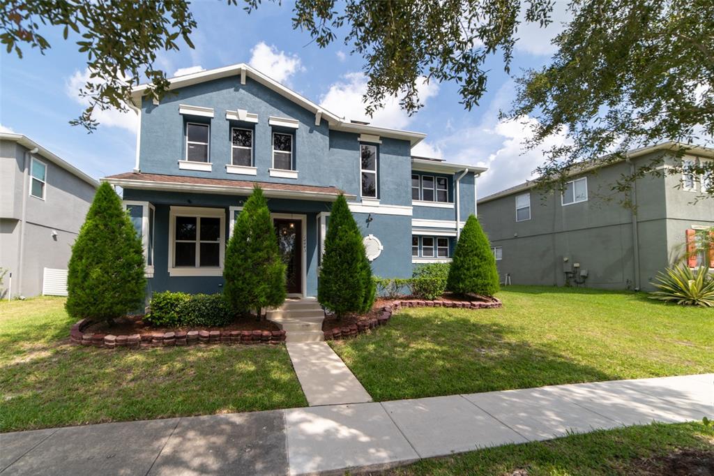 a front view of a house with a yard