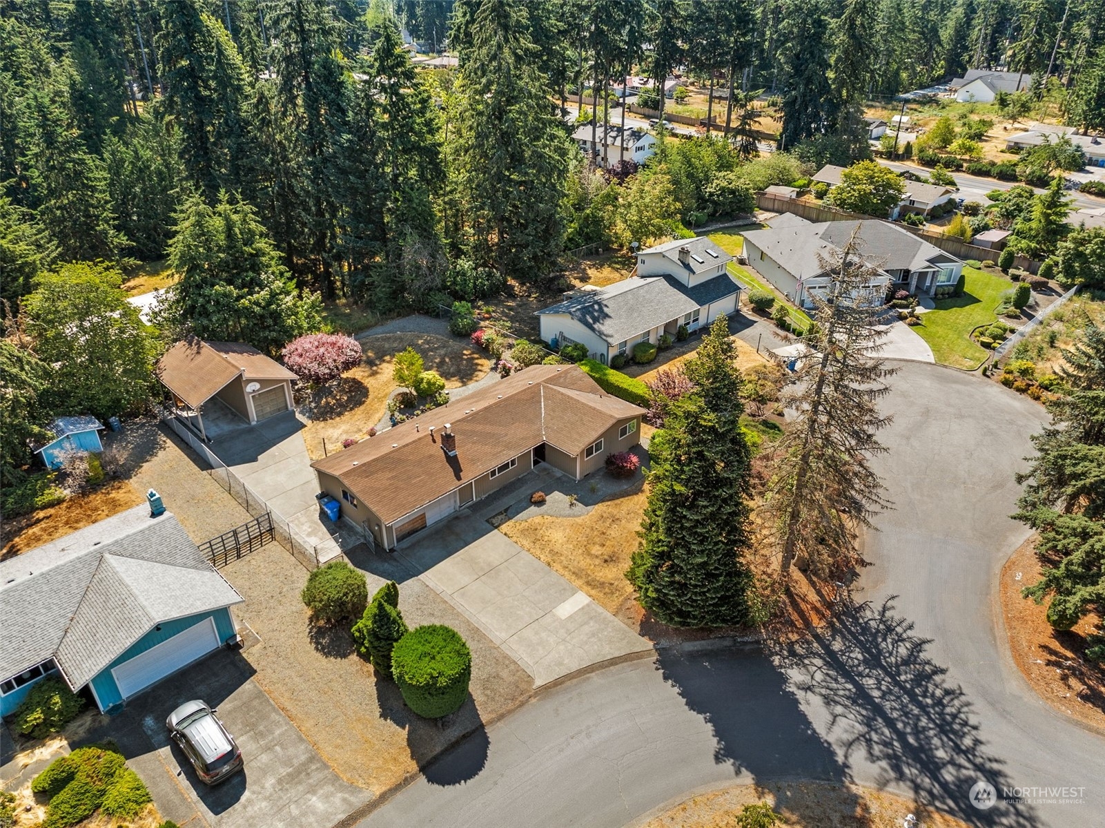 an aerial view of a house with a yard