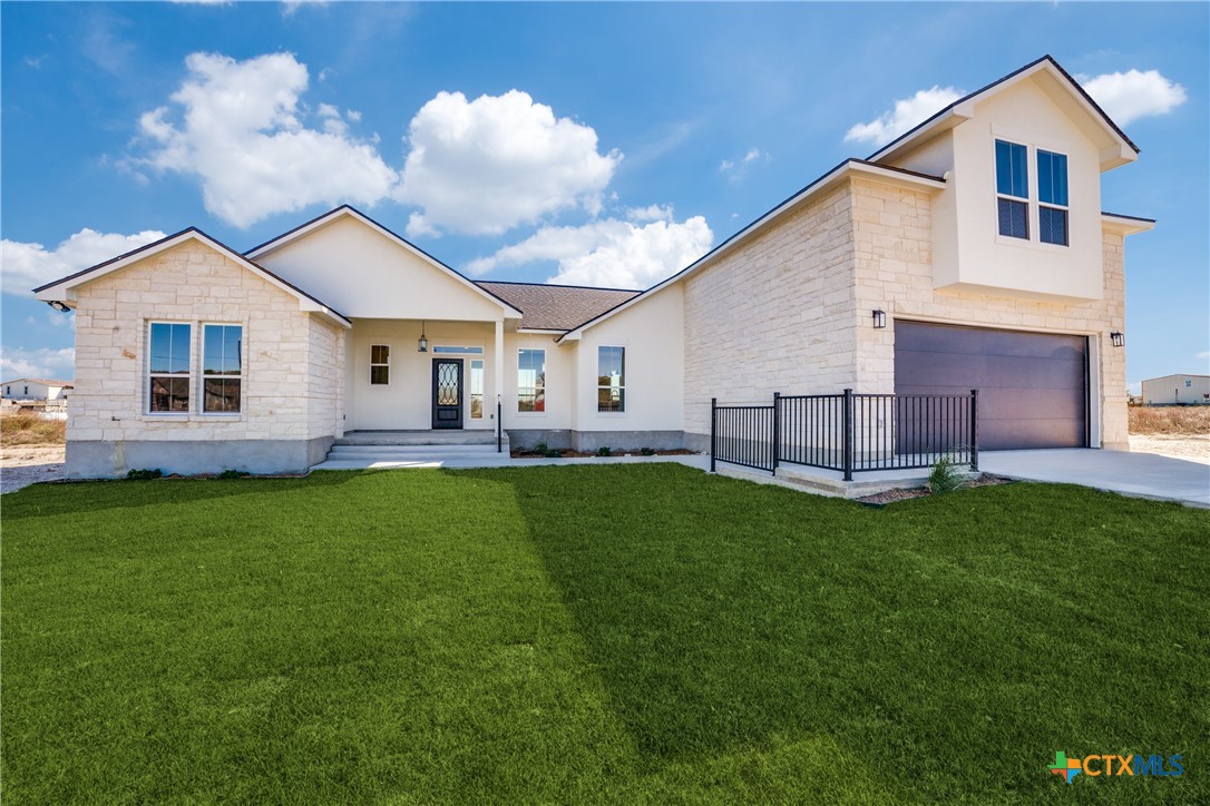 a view of house with a yard