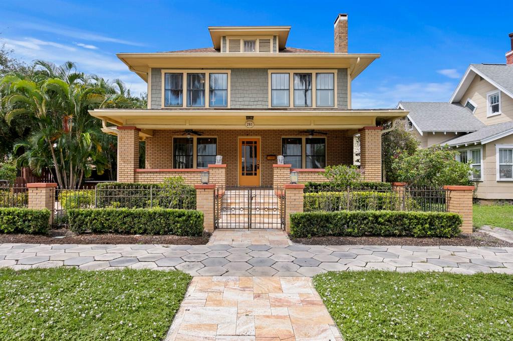 a front view of a house with garden