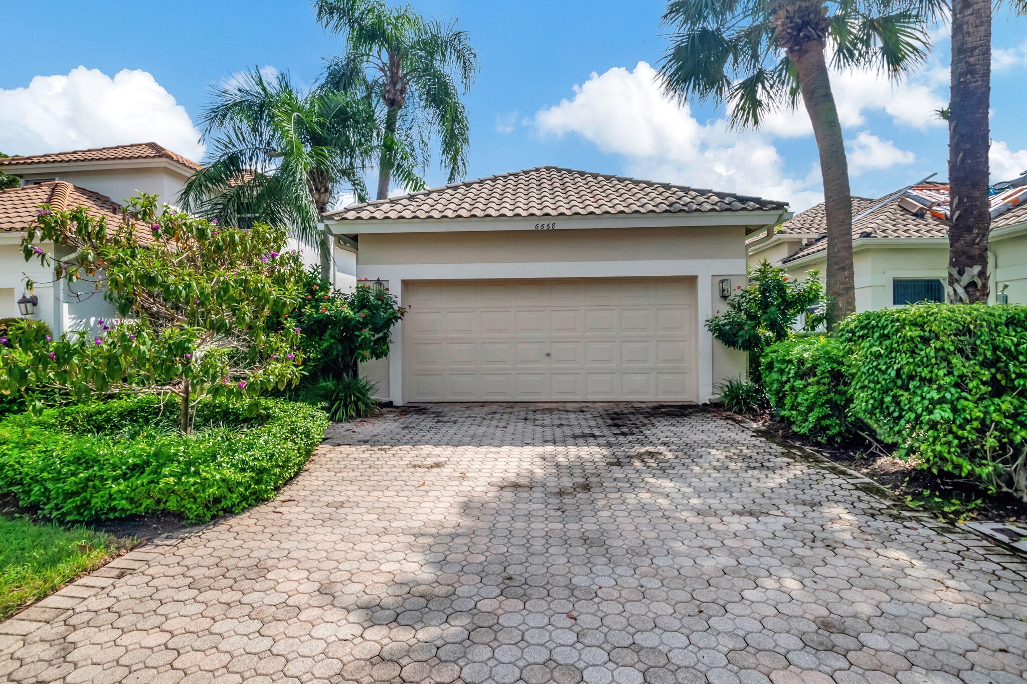 a front view of a house with a garage