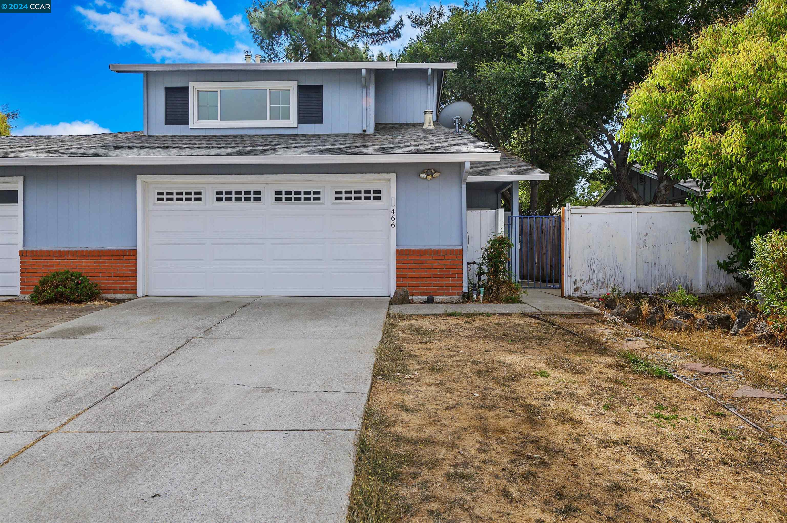 a view of a house with a garage