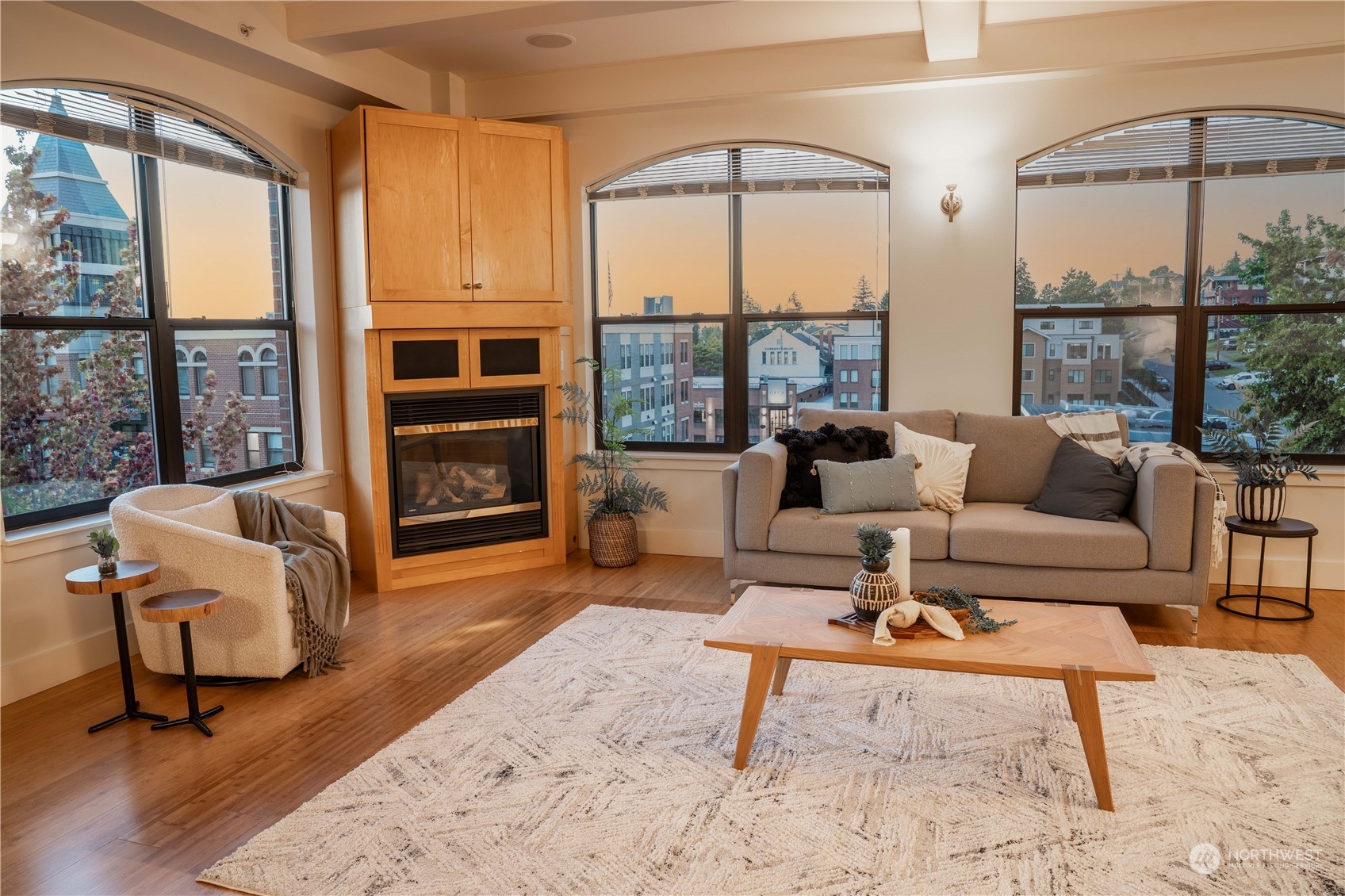 a living room with furniture and a floor to ceiling window