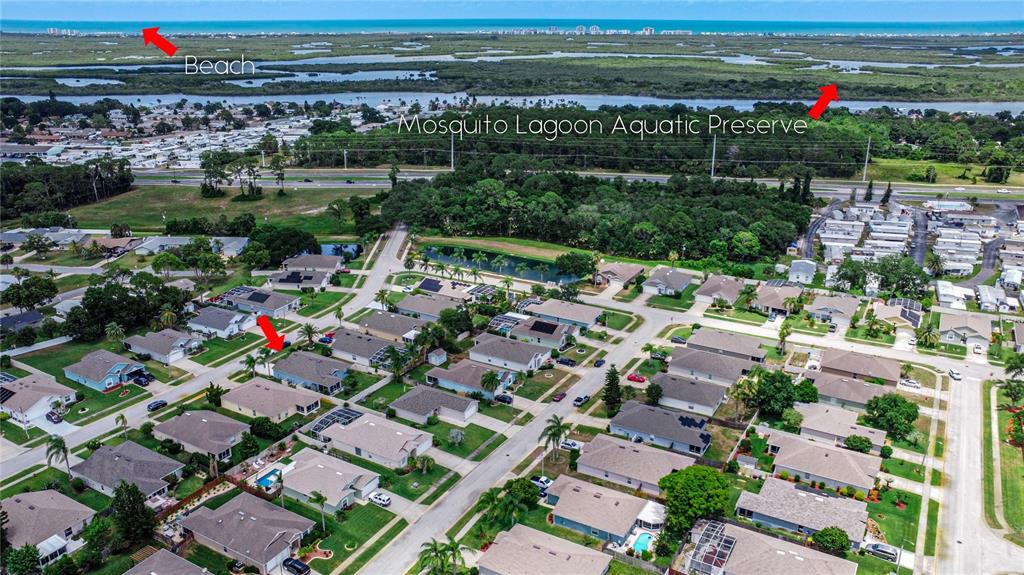 an aerial view of a houses with a yard