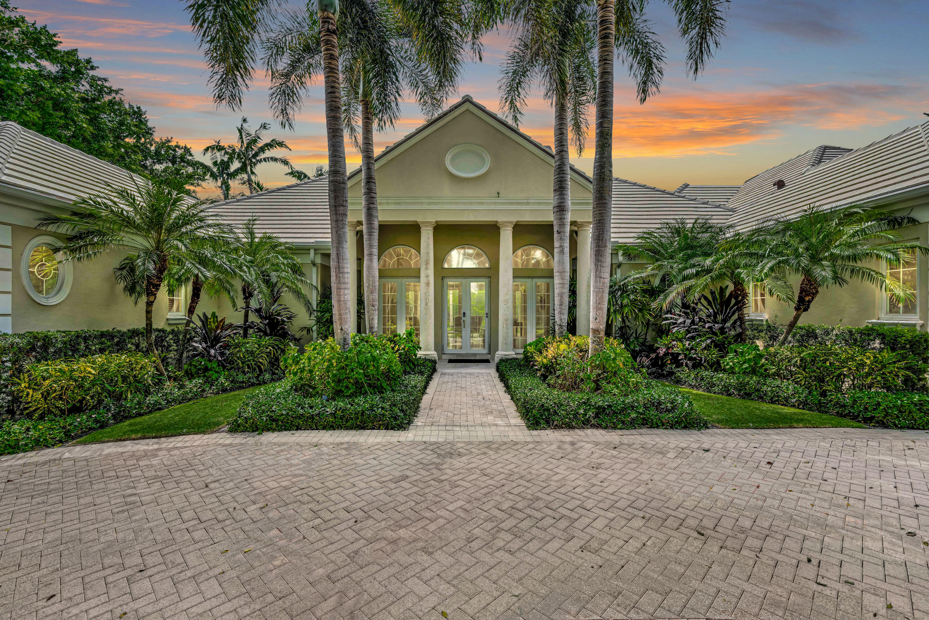 a view of house with a palm trees