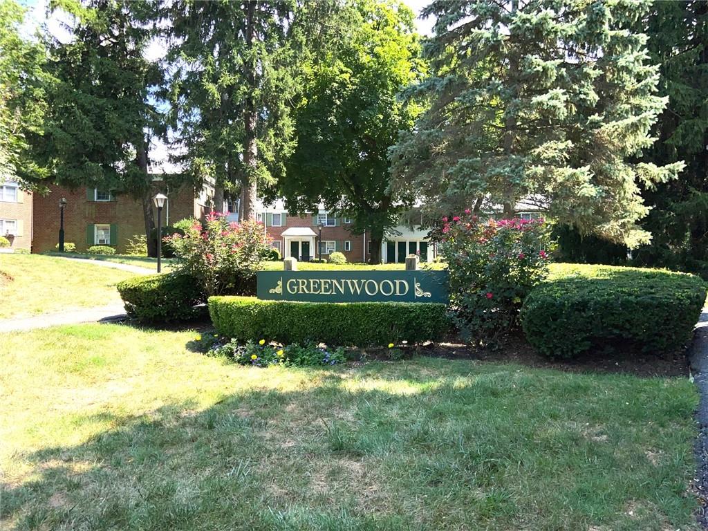 Community Condo sign with a lawn