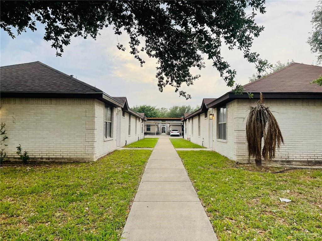 View of property exterior featuring a yard