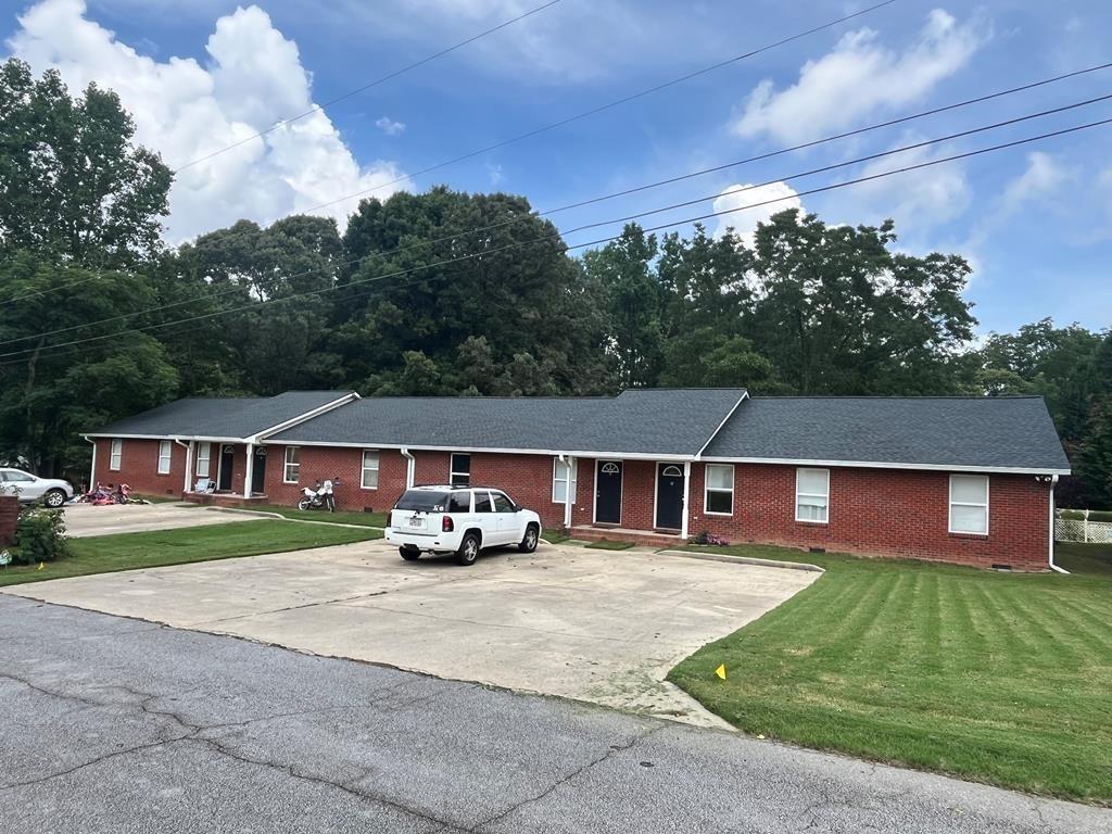 front view of a house with a yard