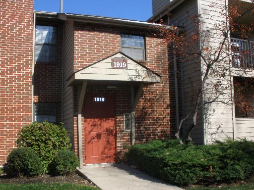 a front view of a house with parking