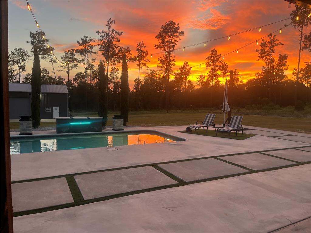 a view of outdoor space with swimming pool