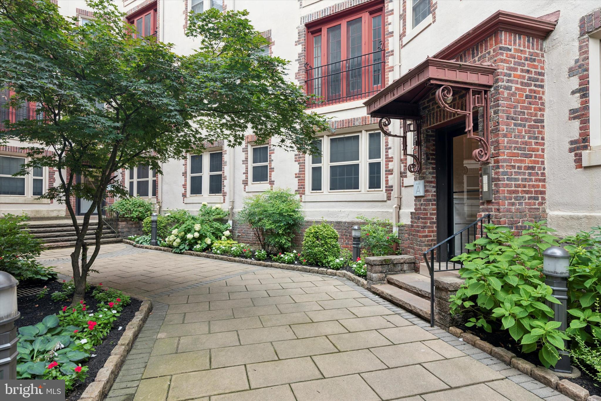 a view of a house with potted plants