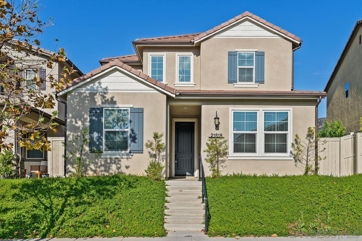 front view of a house with a yard