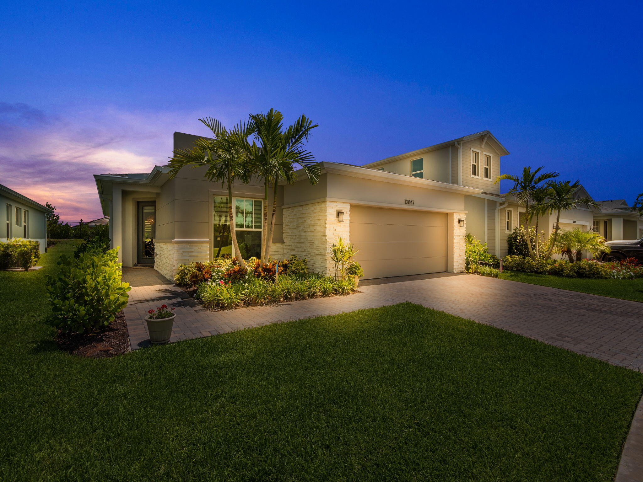 a front view of a house with a yard