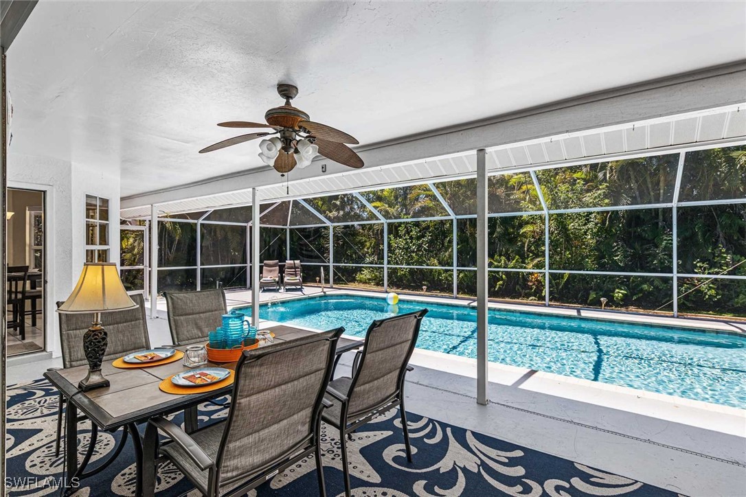 a view of a porch with furniture and floor to ceiling window