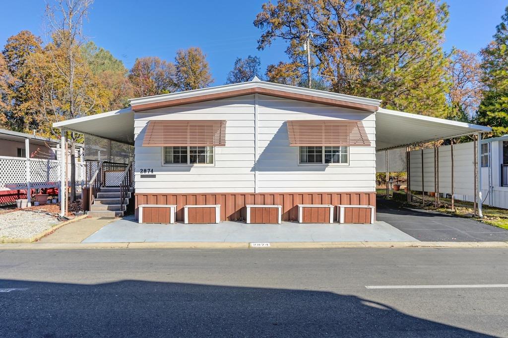 a front view of a house with a garage