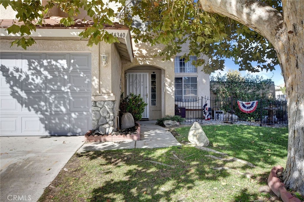 a view of house with yard