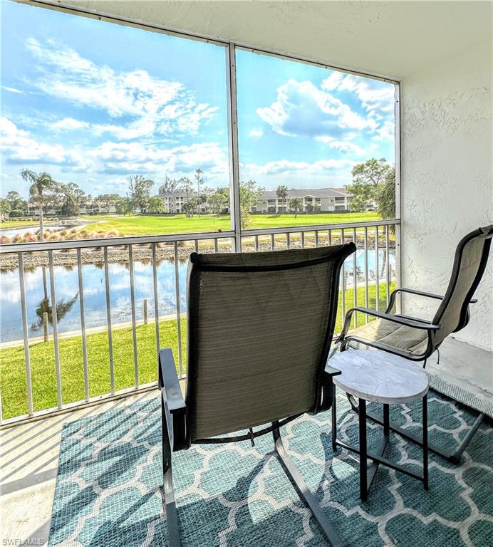 a view of a chairs and table in the balcony