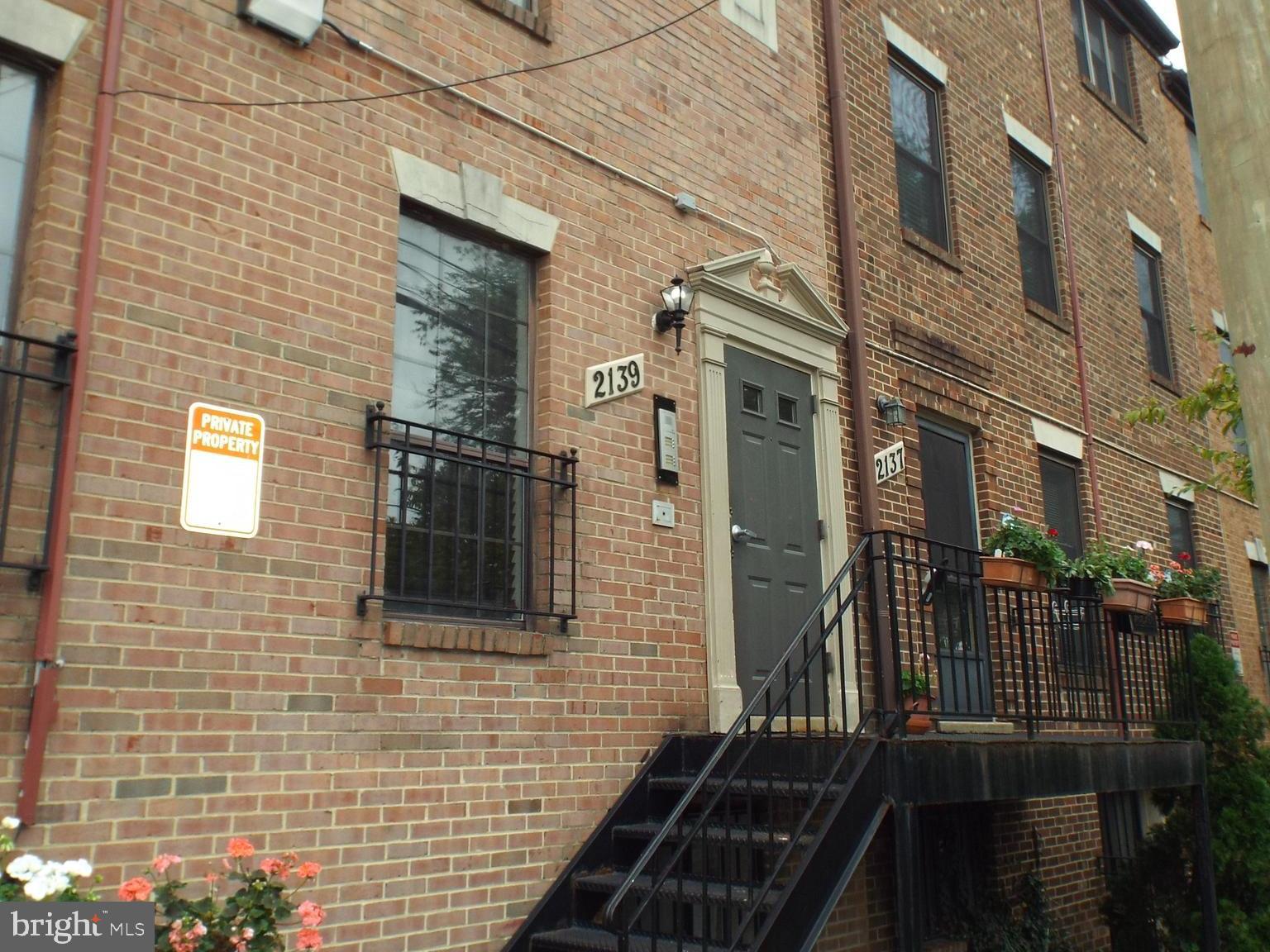 a view of a brick building with many windows