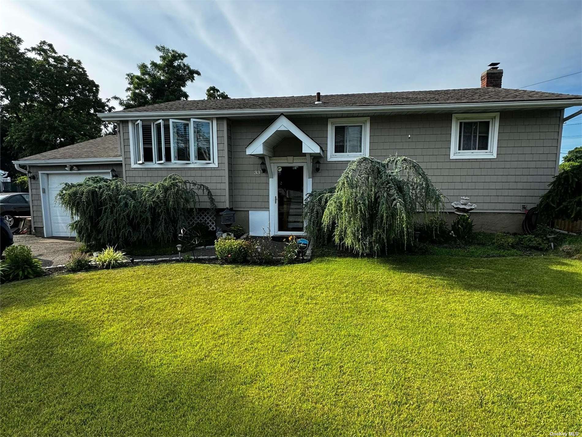 a house view with a garden space