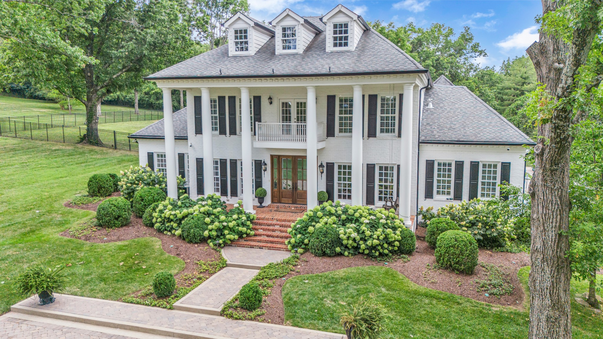 front view of a house with a yard