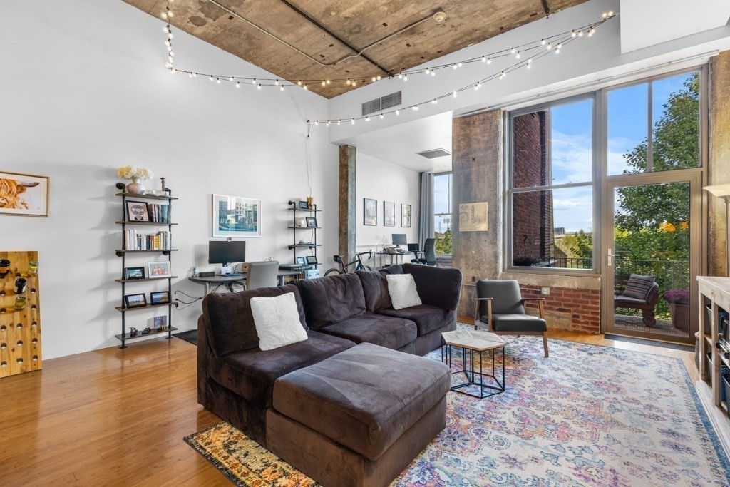 a living room with furniture and a large window