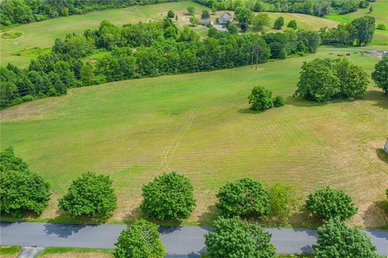 a view of a lake with a yard