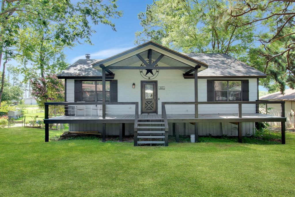 a front view of house with yard and seating area