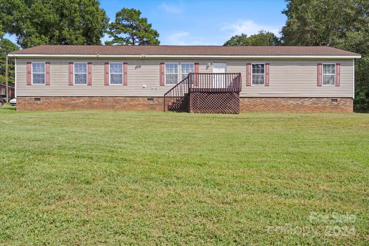 front view of a house with a big yard