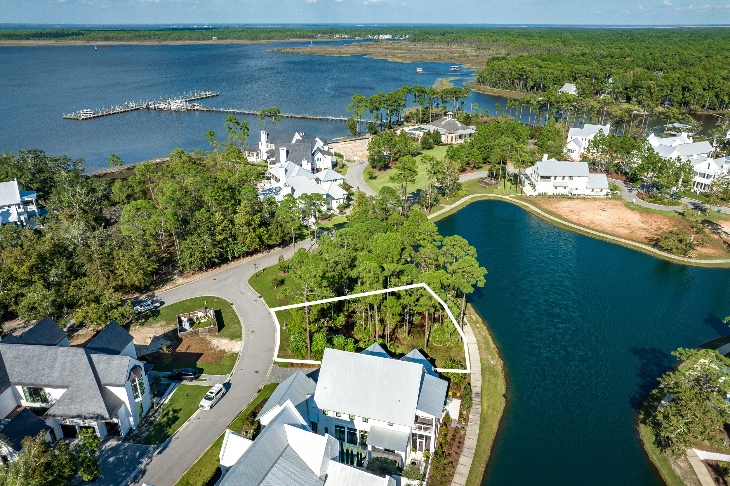 an aerial view of a house with a yard lake view and mountain view