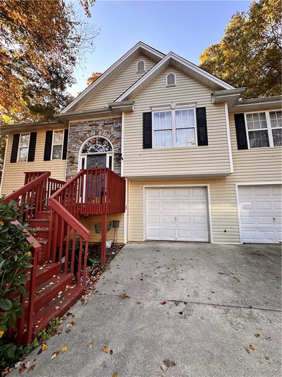 a front view of a house with garage