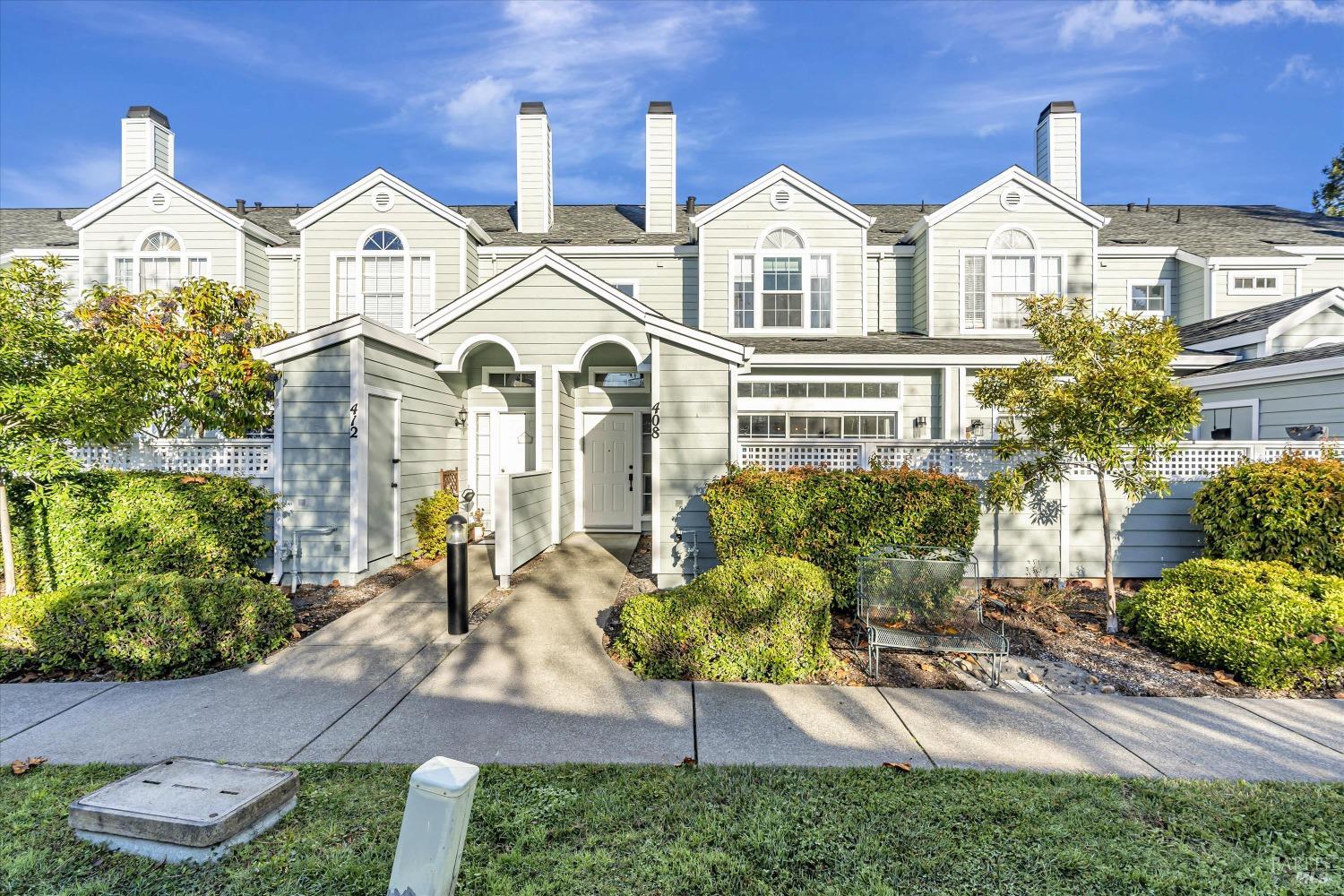 a front view of a house with a garden