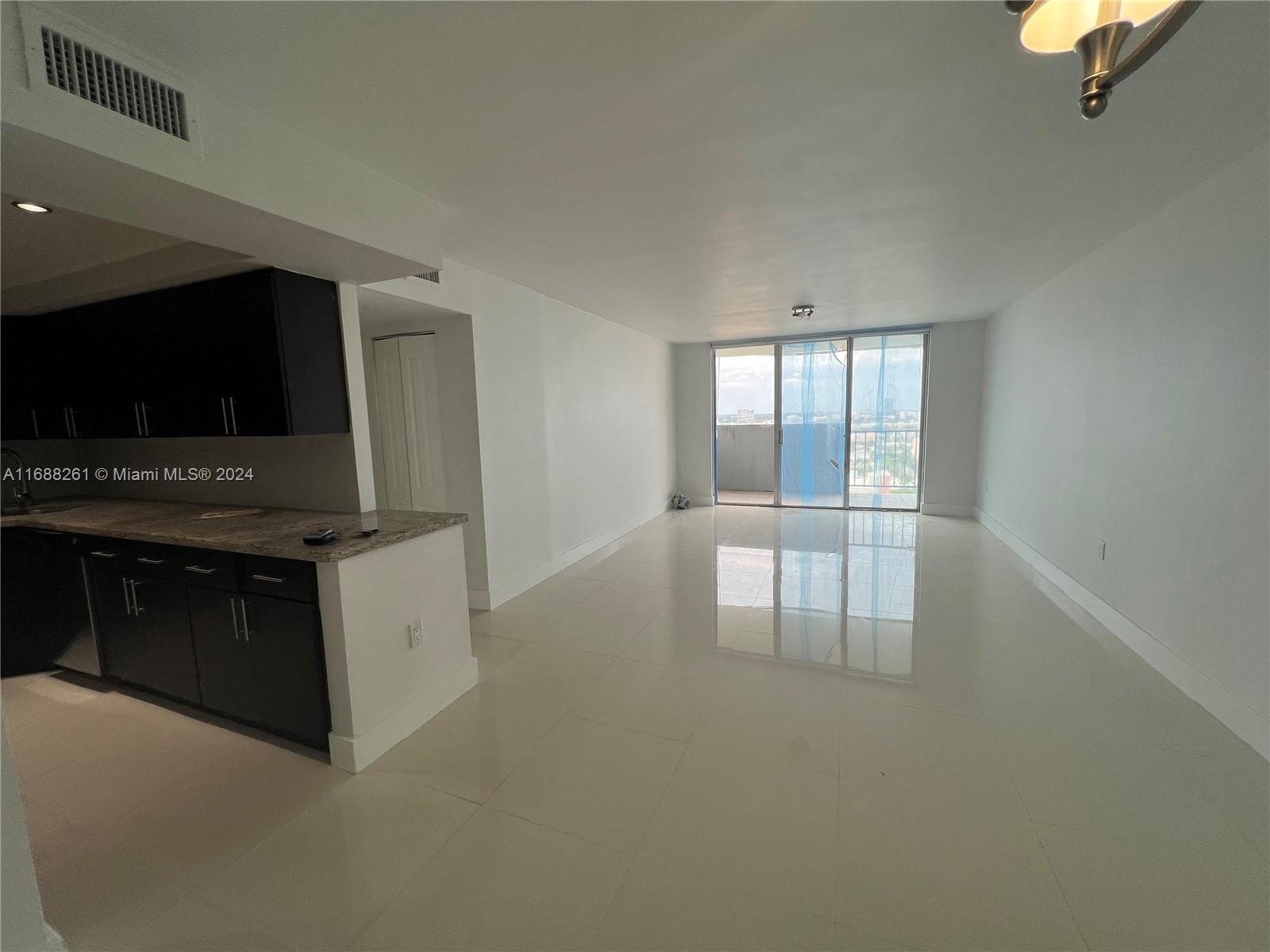 a kitchen with stainless steel appliances a stove and a microwave