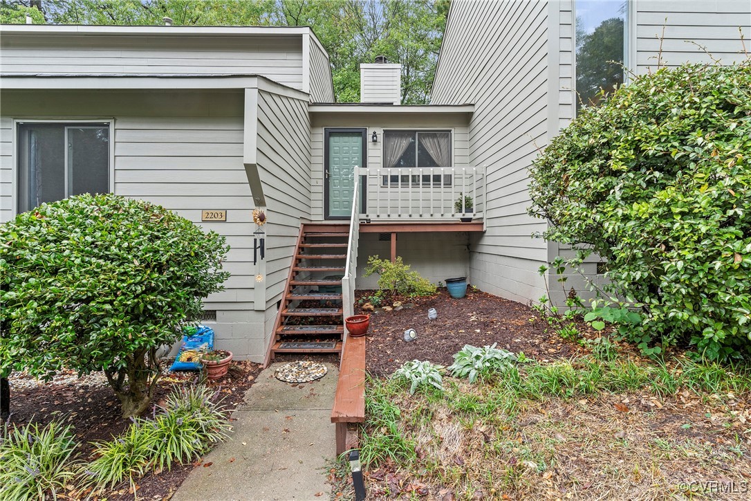 a front view of a house with entryway and stairs