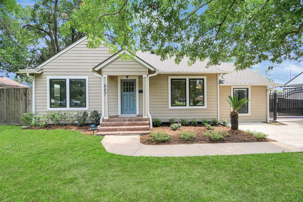 a front view of a house with a yard and porch