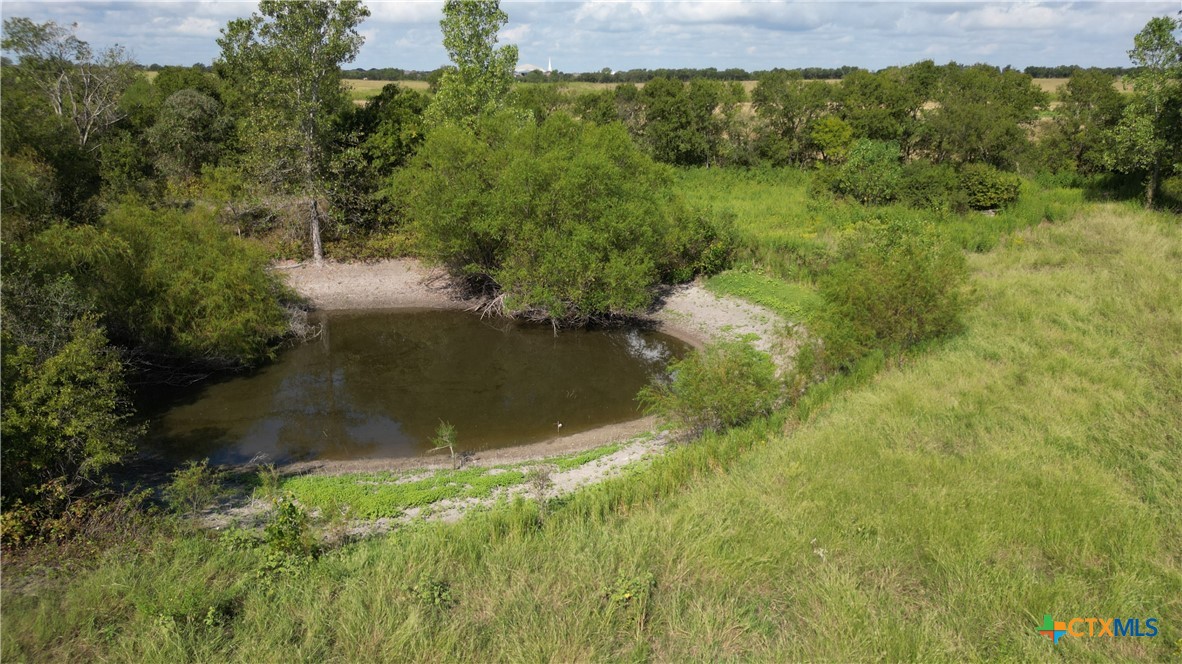 a view of a lake with a yard