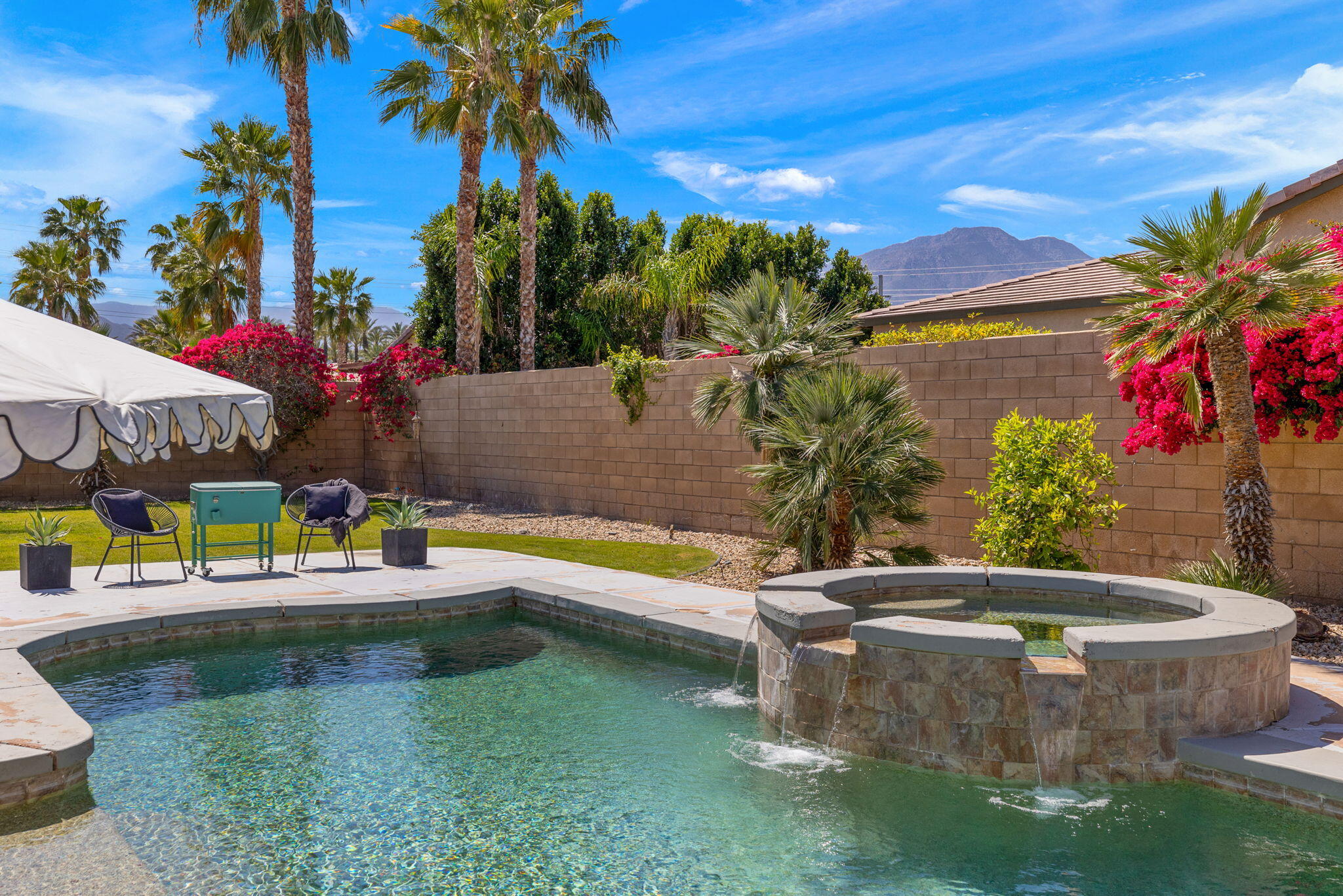 a view of a swimming pool with a patio