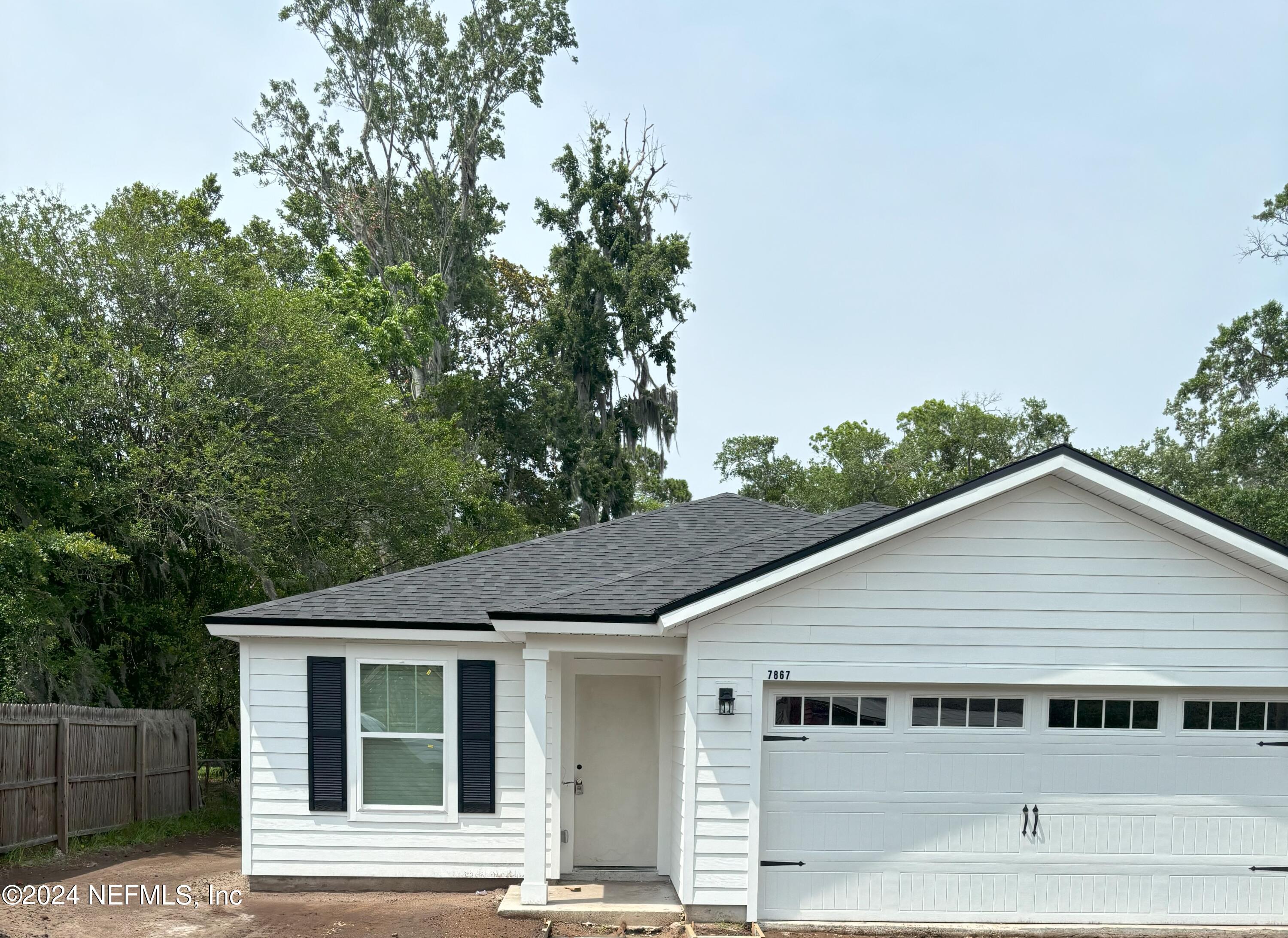 front view of a house with a tree