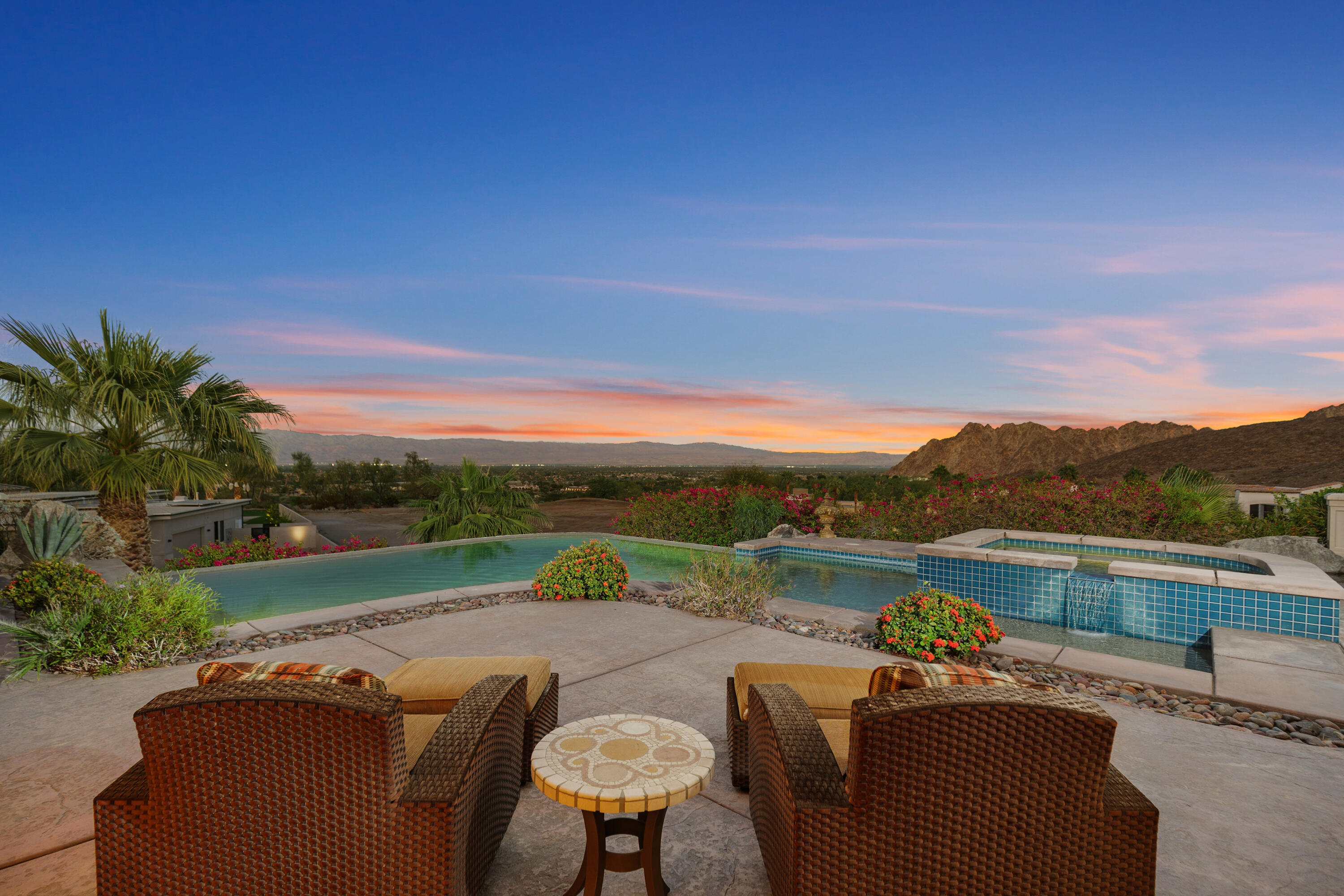 a view of swimming pool with outdoor seating