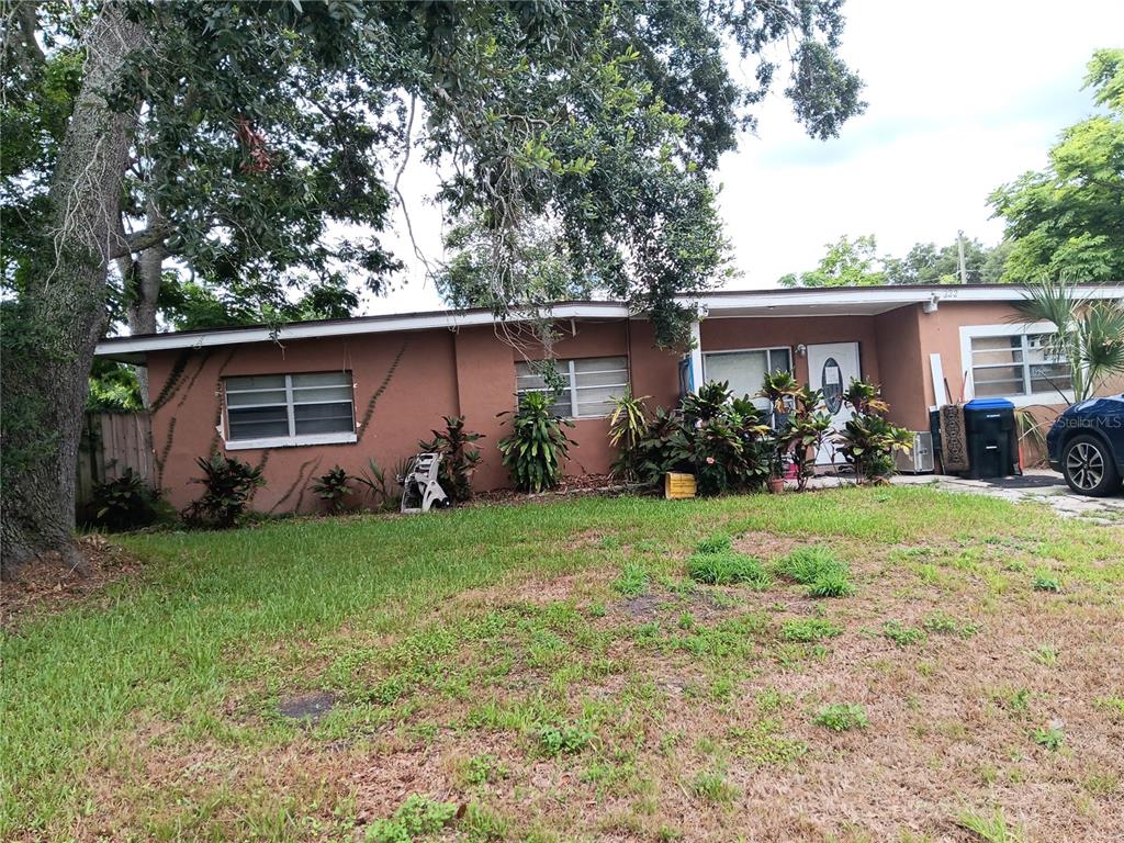 front view of a house with a yard