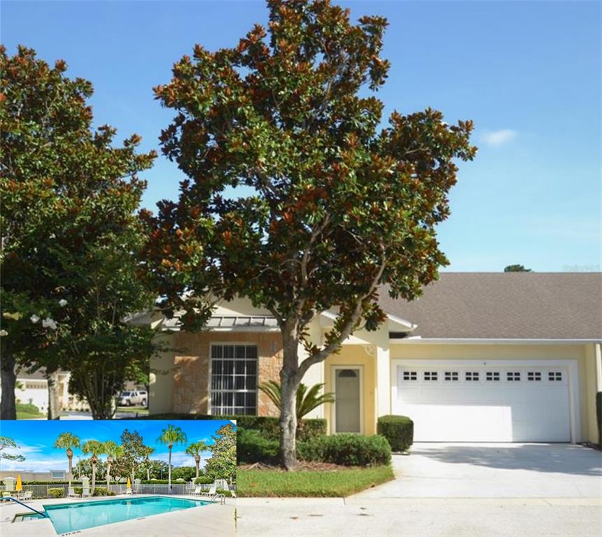 front view of a house with a tree