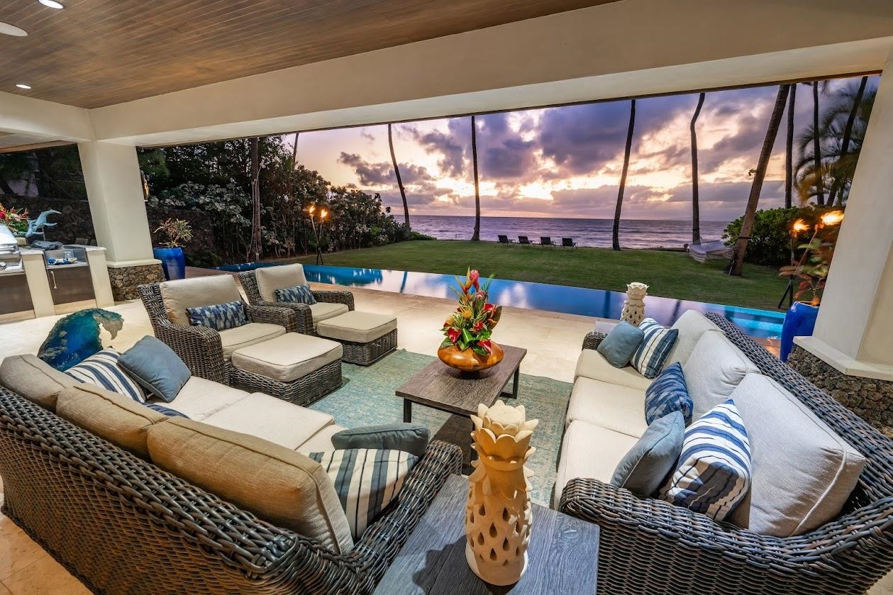 a living room with furniture and a floor to ceiling window