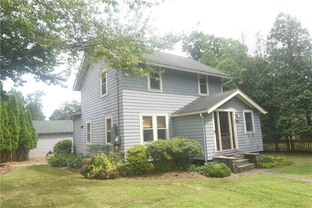 View of front of property with a front yard