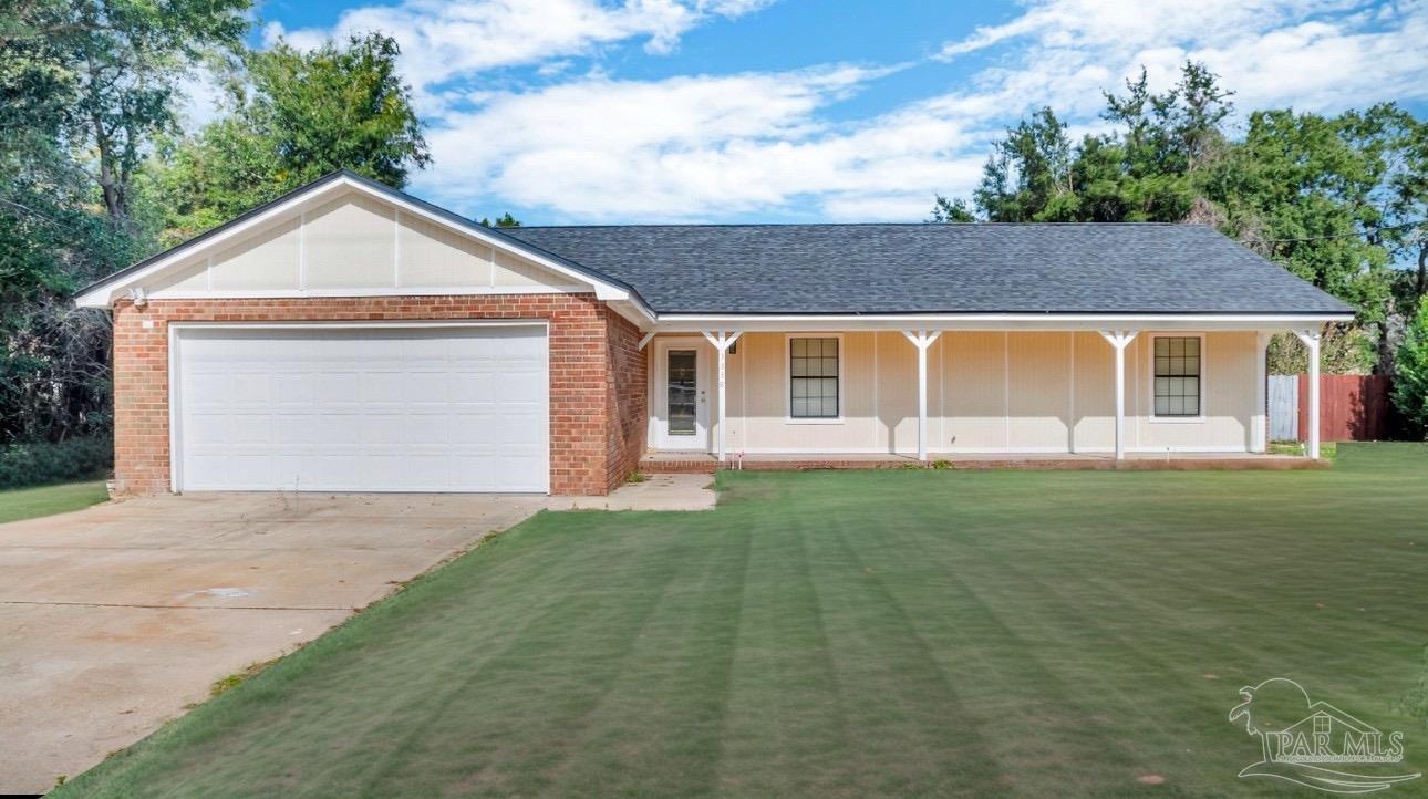 a view of front of house with a yard