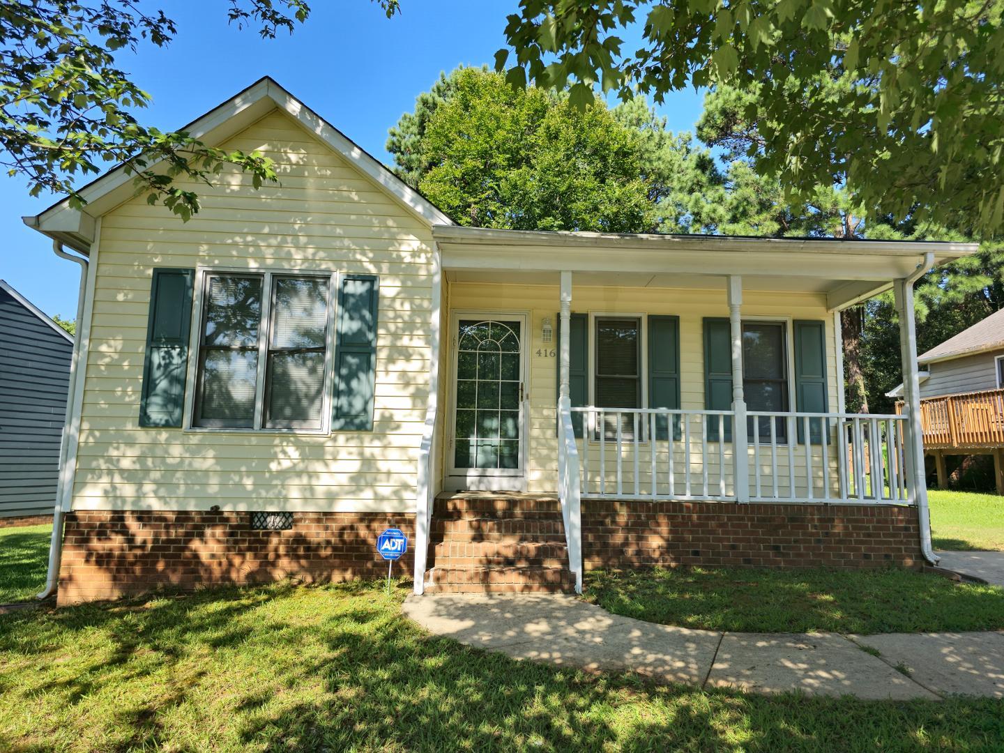 front view of a house with a yard