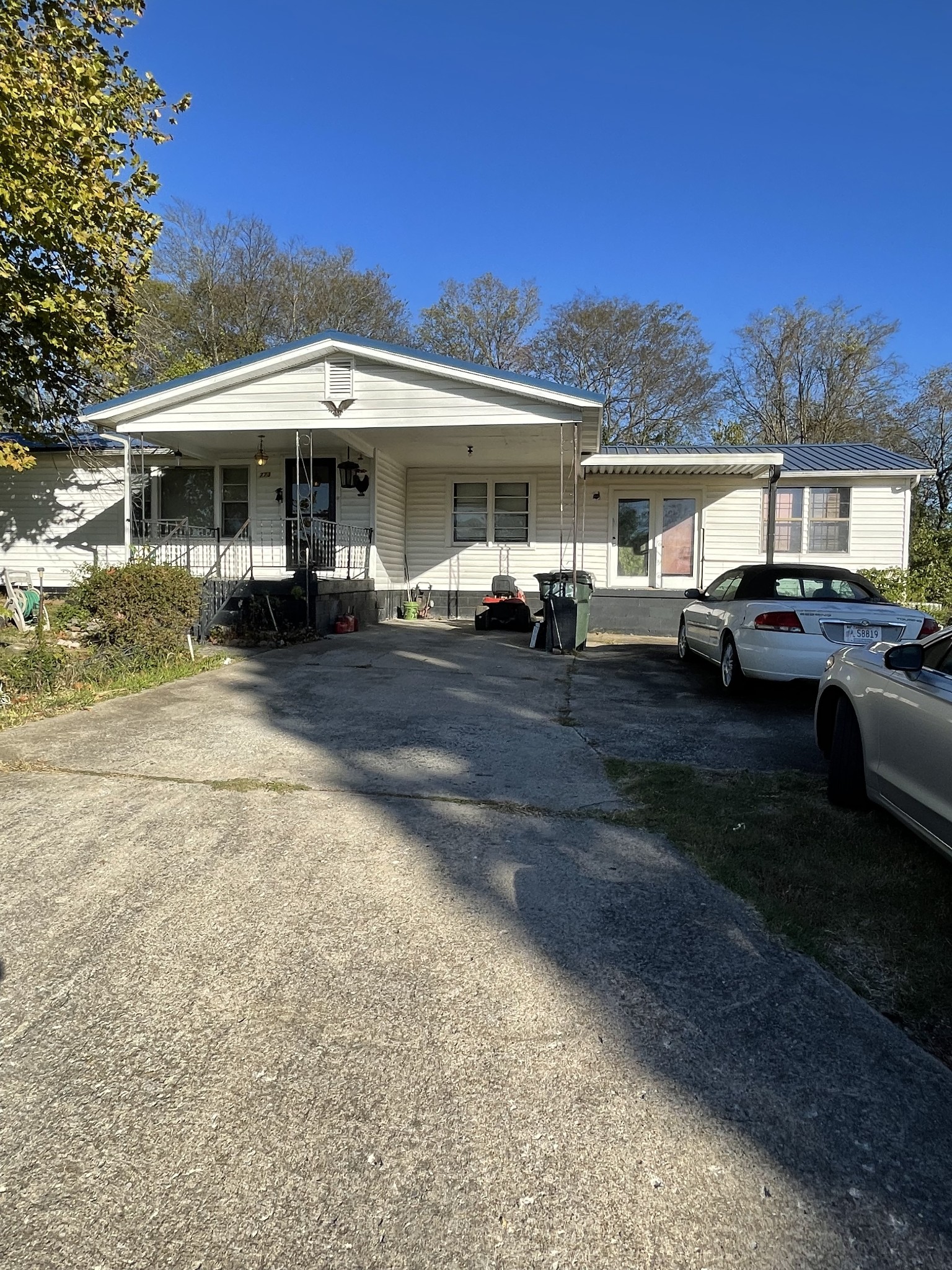 a front view of a house with a garden and patio