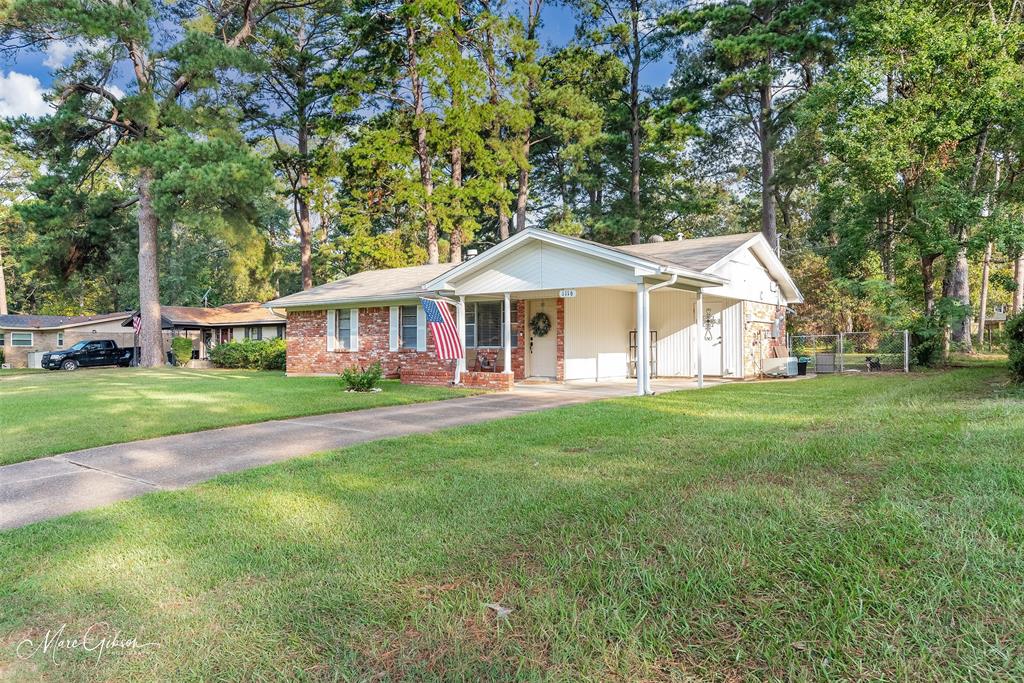 a view of an house with backyard porch and sitting area